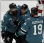  ?? SCOT TUCKER — THE ASSOCIATED PRESS ?? Sharks center Joe Thornton, Kevin Labanc and Brent Burns (88) celebrate a Burns’ goal during a 4-1 win over Ottawa on Saturday.