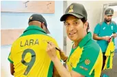  ?? TWITTER ?? Sachin Tendulkar signs on Brian Lara’s jersey during the Australian bushfire relief charity match at Melbourne’s Junction Oval on Sunday. —