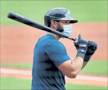  ?? NANCY LANE / BOSTON HERALD ?? New Red Sox infielder Jose Peraza waits in the on deck circle during an intrasquad game Tuesday at Fenway Park.