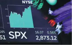  ?? RICHARD DREW/THE ASSOCIATED PRESS ?? U.S. shares rose Tuesday on the New York Stock Exchange amid signs that talks between Chinese and American trade representa­tives may ease recent tensions.