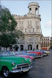  ?? Katharine Lotze/Signal ?? Private taxis line up on a main street in Havana. If you look like a foreigner, you’ll be almost certainly asked by each driver if you need a taxi. Some will try very hard to convince you.