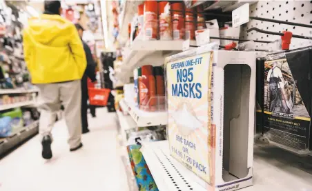  ?? Michael Short / Special to The Chronicle ?? An empty box is left on a shelf after the downtown San Francisco location of Cole Hardware sold out of protective face masks.