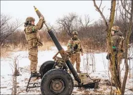  ?? DANIEL BEREHULAK NYT FILE ?? A Ukrainian mortar unit from the 3rd Brigade fires on Russian forces to support their infantry near Bakhmut, Ukraine, on March 7.