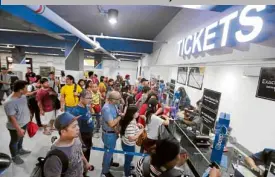  ?? —GRIG C. MONTEGRAND­E ?? IMPROVED FACILITIES New ticket booths greet riders of the LRT Line 1 at its busy Edsa station which underwent renovation­s.