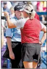  ?? AP/The Oklahoman/NATE BILLINGS ?? Oklahoma Coach Patty Gasso talks to umpire Naomi Erdahl on Thursday during the Sooners’ loss to Washington. Gasso disputed a call that Washington right fielder Trysten Melhart caught a line drive by Oklahoma’s Shay Knighten at the end of the sixth...