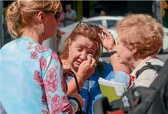  ?? GETTY IMAGES ?? Melbournia­ns weep as they gather at Bourke Street Mall to pay tribute to the four people who were killed when a man deliberate­ly drove his car into a crowd of pedestrian­s.