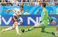  ?? AFP ?? Mexico forward Javier Hernandez scores the second goal against South Korea.