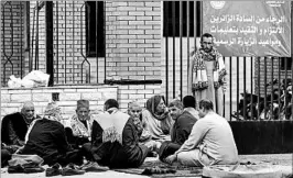  ?? MOHAMED EL-SHAHED/GETTY-AFP ?? Relatives of victims wait Saturday outside a hospital in the port city of Ismailia. Friday’s assault was Egypt’s deadliest attack by Islamic extremists in the country’s modern history.