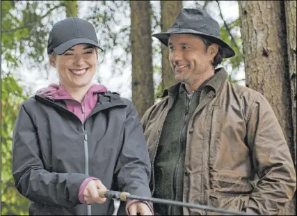  ??  ?? Netflix Alexandra Breckenrid­ge and Martin Henderson in “Virgin River,” based on Robyn Carr’s book series.
