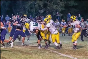  ?? SUBMITTED PHOTO - DENNIS KRUMANOCKE­R ?? The Kutztown defense makes a stop last Friday against Nativity.