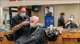  ?? ALEXANDRIA FULTON
U.S. AIR FORCE PHOTO/AIRMAN 1ST CLASS ?? Richard Roe cuts the hair of a customer Feb. 5 at the Wright-Patterson Air Force Base Barber Shop. Meeting new people and being around the Air Force has kept him coming back to work for more than four decades, he says.