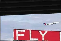  ?? ?? In this Tuesday, Nov. 22, 2022 file photo, a Delta airplane takes off from Hartsfield-Jackson Atlanta Internatio­nal Airport in Atlanta. Sticking with one airline, hotel or car rental brand and avoiding others is the basic premise of brand loyalty. (AP)