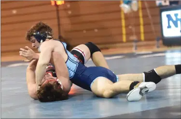  ?? MIKE CABREY — MEDIANEWS GROUP ?? North Penn’s William Mayland looks for a pin against Vincent Tomasetti during their 152-pound match on Wednesday.