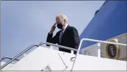  ?? PATRICK SEMANSKY — THE ASSOCIATED PRESS ?? President Joe Biden boards Air Force One at Andrews Air Force Base, Md., on Friday.