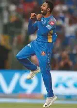  ?? AFP ?? Shreyas Gopal of Rajasthan Royals celebrates a wicket against RCB.