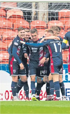  ?? Picture: SNS. ?? Former United player Billy Mckay celebrates with his team-mates.