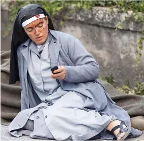  ??  ?? Calling for help: A nun in Amatrice, one of the worst-hit towns