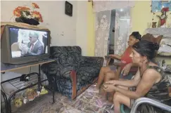  ??  ?? 0 A woman watches on television in Havana as Cuba’s new president Miguel Diaz-canel takes over from Raul Castro