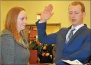  ?? BARRY TAGLIEBER — FOR DIGITAL FIRST MEDIA ?? Patrolman Peter Karpovich is sworn in at Wednesday night’s Phoenixvil­le Borough Council meeting.