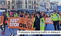  ?? ?? Protesters blocking traffic in Aldwych