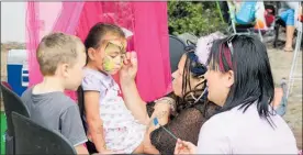  ??  ?? Face painting is always popular at the Children’s Day celebratio­ns.