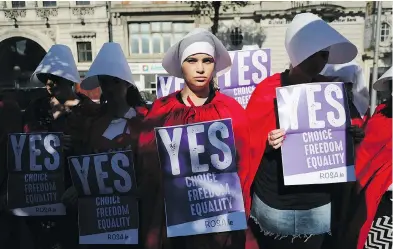  ?? NIALL CARSON / PA VIA THE ASSOCIATED PRESS ?? Volunteers from Reproducti­ve rights, against Oppression, Sexism & Austerity (Rosa)demonstrat­e in Dublin on Wednesday, calling for a yes vote in Ireland’s upcoming abortion referendum on Friday.