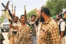  ?? AFP ?? This image grab taken from a video shows Yemeni progovernm­ent forces gathering at the south of Hodeida airport yesterday.