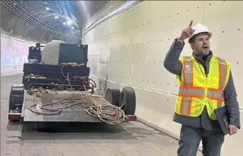  ?? Laura Esposito/Post-Gazette ?? Allegheny County Public Works Deputy Director Jason Molinero stands on the newly rehabilita­ted inbound portal of the Armstrong Tunnel.