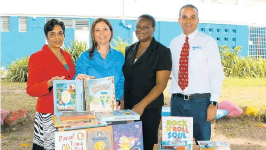  ?? CONTRIBUTE­D ?? (From left) Chairperso­n of the ICWI Group Foundation Valerie Reynolds; VP, marketing, distributi­on, & HR, Samantha Samuda; director of the Jamaica National Children’s Home, Nadeen Waugh; and chairman of the Jamaica Library Service (JLS) and president of ICWI, Paul Lalor, are pictured in a moment of giving during the donation of more than 100 books on Tuesday to wards of the State affiliated with the Jamaica National Children’s Home. The wards have been temporaril­y reassigned because of a fire several months ago.