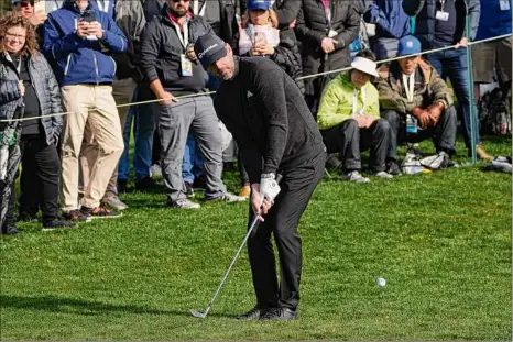  ?? Godofredo A. Vásquez / Associated Press ?? Aaron Rodgers follows his shot onto the 16th green of the Pebble Beach Golf Links during the third round of the AT&T Pebble Beach Pro-am golf tournament in Pebble Beach, Calif., on Sunday.