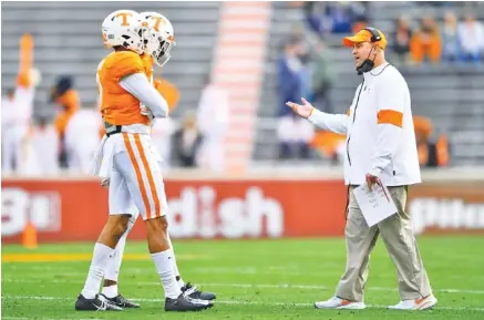 ?? BRIANNA PACIORKA/KNOXVILLE NEWS SENTINEL VIA AP ?? Tennessee football coach Jeremy Pruitt walks onto the field to talk to his players during Saturday’s game against Texas A&M at Neyland Stadium. Pruitt’s Vols lost 34-13 to the fifth-ranked Aggies to finish the regular season 3-7.