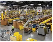  ?? KARA DRISCOLL/STAFF ?? A look inside the Amazon fulfifillm­ent center in Etna. The online giant is looking to hire thousands ofworkers in Ohio.