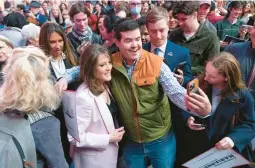 ?? JOSE LUIS MAGANA/AP ?? Self-help author Marianne Williamson, a Democrat, takes a photo with a supporter Saturday as she launches her 2024 presidenti­al campaign in Washington.