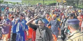  ??  ?? Devotees trek from Nilakkal to Sabarimala temple in Kerala’s Pathanamth­itta district on Monday. This is the second time the shrine opened after the SC allowed the entry of women of all ages into it. PTI