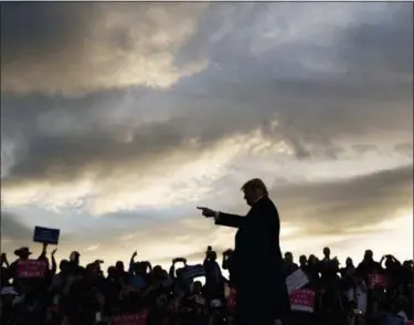  ?? CAROLYN KASTER — THE ASSOCIATED PRESS ?? President Donald Trump arrives as the sun sets to speak at a campaign rally at Minuteman Aviation Hangar, Thursday in Missoula, Mont.