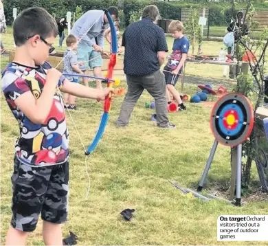  ??  ?? On target Orchard visitors tried out a range of outdoor games second year