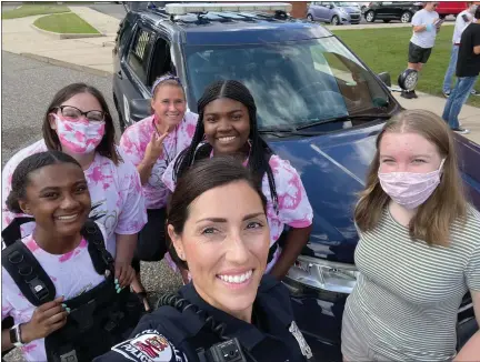  ?? COURTESY FERNDALE POLICE ?? Ferndale police Community and Engagement Officer Jillian Mahlmeiste­r at a summer camp hosted at University High School last year where she and other officers met with middle school students and spoke about the law enforcemen­t profession. Police Chief Dennis Emmi, Mahlmeiste­r and other officers will be on hand Friday, May 20, for the Ferndale Police Department’s inaugural open house.