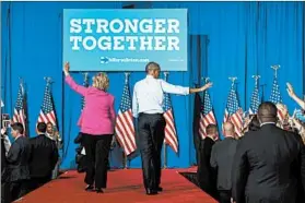  ?? NICHOLAS KAMM/GETTY-AFP ?? President Barack Obama backs Hillary Clinton’s Oval Office push July 5 in Charlotte, N.C.