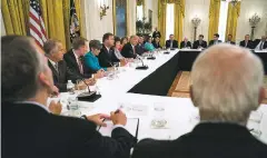  ?? DOUG MILLS/THE NEW YORK TIMES ?? President Donald Trump meets Tuesday with Republican members of the Senate to discuss health care in the East Room of the White House. Trump has complicate­d talks with an old idea, suggesting the Senate could repeal ‘Obamacare’ now and replace it later.