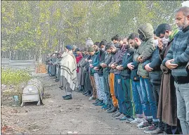  ?? ?? Local pray during the funeral of Mohd Ibrahim Khan, a salesman who was shot dead by terrorists outside the shop of Kashmiri Pandit businessma­n, Sandeep Mawa in Srinagar.