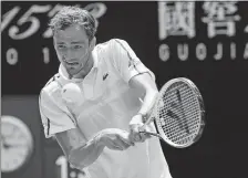  ?? ANDY BROWNBILL/AP PHOTO ?? Daniil Medvedev hits a backhand return to Filip Krajinovic during their third round match on Saturday at the Australian Open in Melbourne.