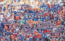  ?? NICK GRAHAM / STAFF ?? Fans cheer on the FC Cincinnati team as they play English Premier League team Crystal Palace in a friendly match at Nippert Stadium in Cincinnati.