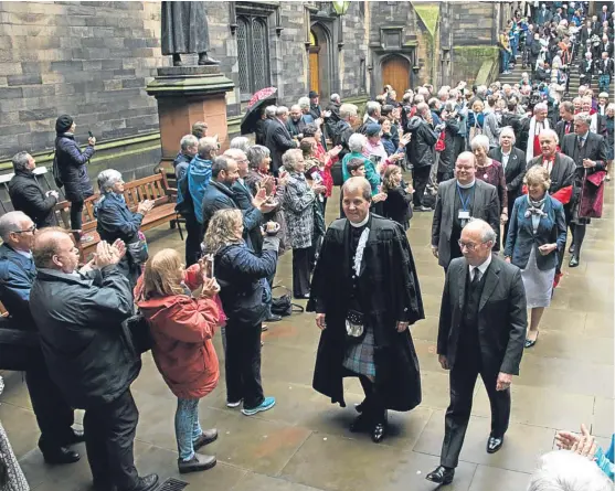  ?? Picture: Andrew O’Brien. ?? The General Assembly comes to a close in Edinburgh with the clapping-out ceremony, with the Moderator the Rt Rev Dr Russell Barr accompanyi­ng Lord Hope, Lord High Commission­er, through the crowd.