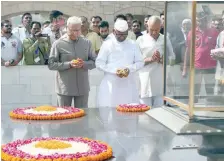  ?? — AFP ?? Anna Hazare pays tribute at Rajghat before beginning the indefinite protest in New Delhi on Friday.