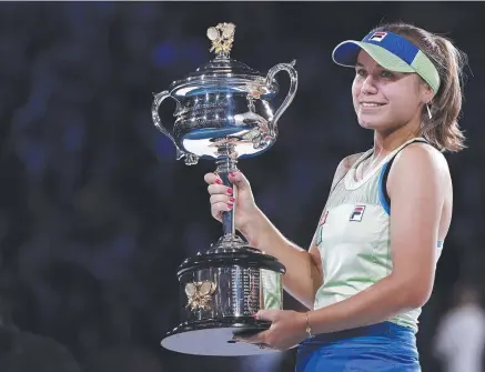  ?? Picture: AP PHOTO ?? Sofia Kenin of the US holds the Daphne Akhurst Memorial Cup after defeating Spain's Garbine Muguruza