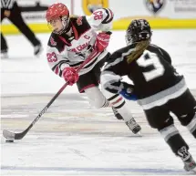  ?? Brian A. Pounds/Hearst Connecticu­t Media ?? New Canaan's Lexie Tully skates the puck in to the offensive zone in the first period of the Rams' 3-0 victory over Stamford/Westhill/Staples in the girls hockey state championsh­ip game at Quinnipiac University in Handen on Wednesday, March 6.