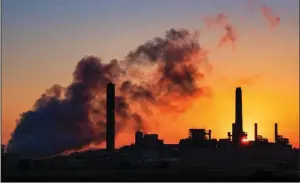  ?? (AP) ?? The Dave Johnson coal-fired power plant is silhouette­d against the morning sun in Glenrock, Wyo., in this file photo. A federal appeals court Tuesday struck down plans to roll back climate regulation­s on such plants.