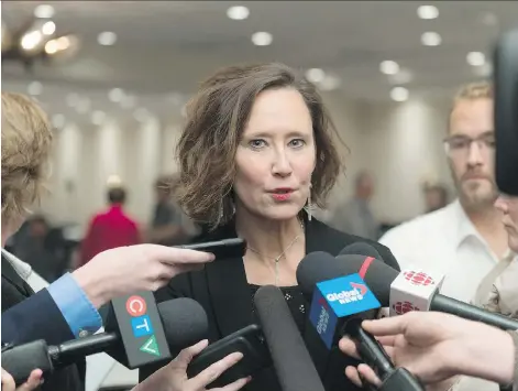  ?? MICHAEL BELL ?? Education Minister Bronwyn Eyre speaks to reporters about treaty education after addressing the Saskatchew­an School Boards Associatio­n in Regina on Tuesday. Eyre has been in the spotlight recently over comments she made about how treaty education in...