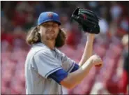  ?? JOHN MINCHILLO — THE ASSOCIATED PRESS ?? New York Mets starting pitcher Jacob deGrom reacts in the first inning against the Cincinnati Reds. deGrom was trying to win his 15th game.
