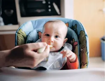  ?? | SUPPLIED ?? A BABY eating cereal.